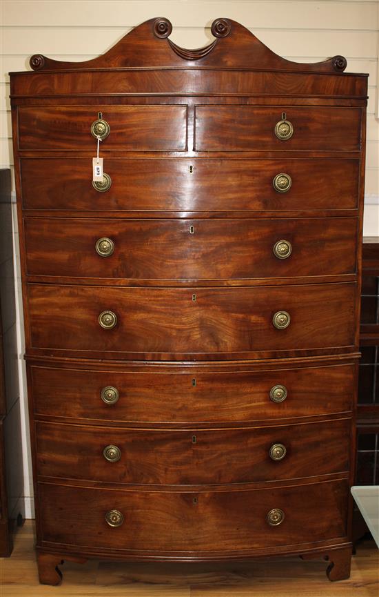 A Regency mahogany bow fronted chest on chest, fitted two short and six graduated long drawers, on bracket feet, W.112cm